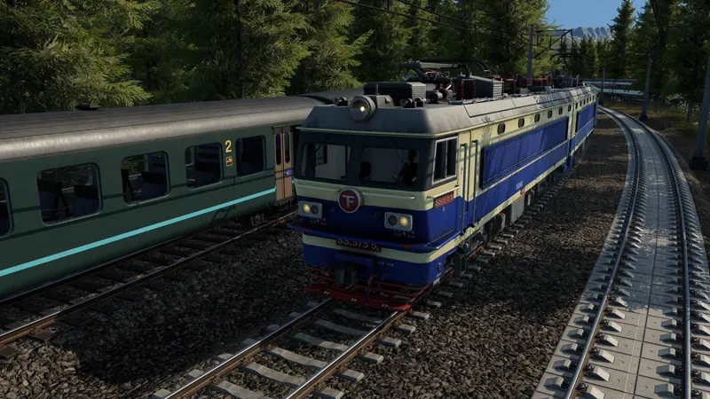 Passenger and freight trains share a wooded railway corridor in Transport Fever 3